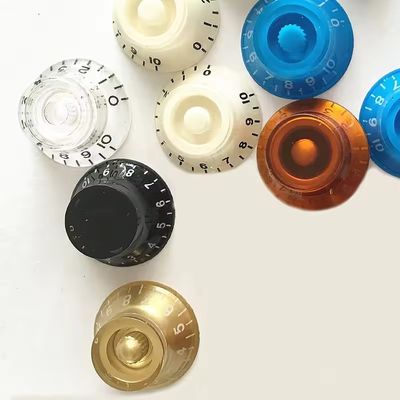 Guitarra eléctrica Bajo eléctrico Botones de control de tono de volumen Potenciómetro Cabeza ABS Botón de guitarra multicolor